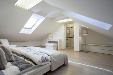 Bedroom connected with bathroom in the attic - obrazy, fototapety, plakaty