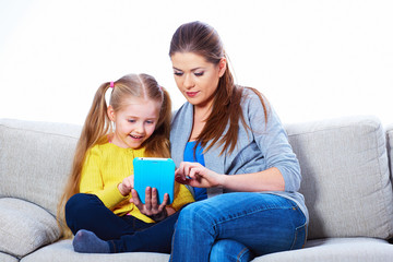 Mother and daughter using tablet PC