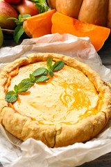 Homemade pumpkin pie on table