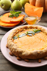 Homemade pumpkin pie on table