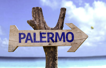 Palermo wooden sign with a beach on background