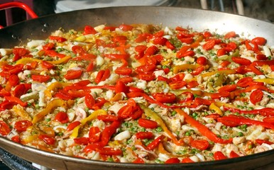 Valencian paella with seafood and tomato