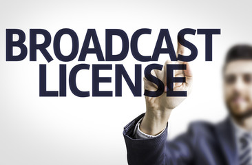 Business man pointing the text: Broadcast License