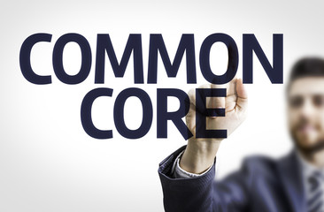 Business man pointing the text: Common Core