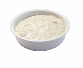 Bowl of oats porridge  isolated on white