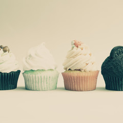 Vintage cupcakes over light background