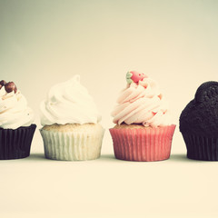 Vintage cupcakes over light background