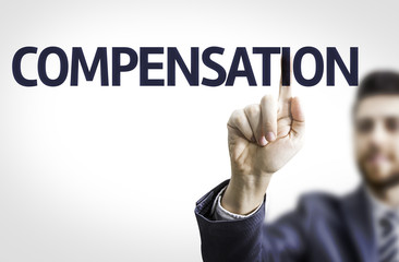 Business man pointing the text: Compensation