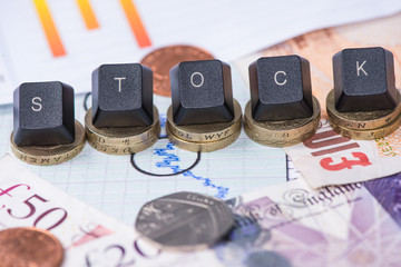 Financial stock word over graph and coins