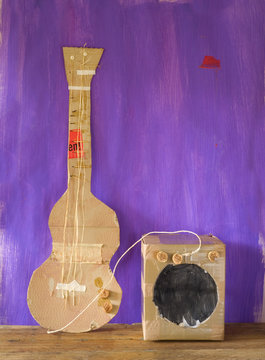 grungy cardboard guitar w. amplifer, free copy space