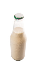 A bottle of soybean milk over white background