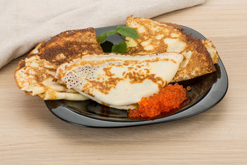 Pancakes with red caviar