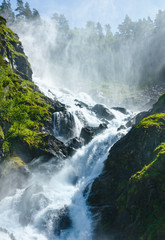 Fototapeta premium Summer Latefossen waterfall on mountain slope (Norway).