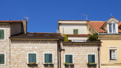 facade of an old house with a tiled roof