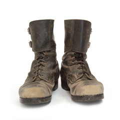Old army combat boots on white background.