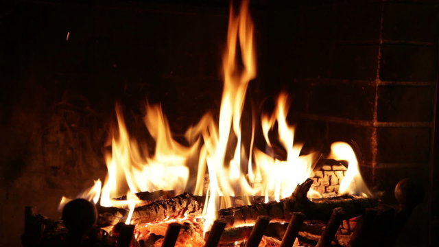 burning fire in the fireplace