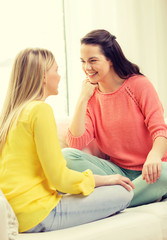 two girlfriends having a talk at home