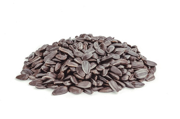 Sunflower seeds pile against white background