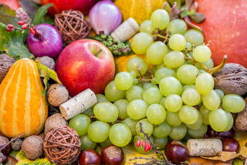 Naklejka na ściany i meble Autumn arrangement of a bunch of fruits and vegetables. Close-up