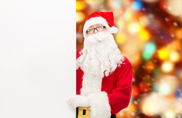 man in costume of santa claus with billboard