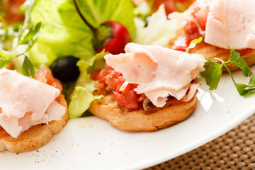 Bruschetta with tomato and ham