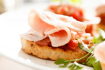 Bruschetta with tomato and ham