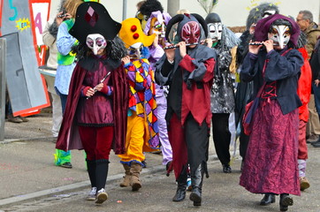 Fototapeta na wymiar Colourful parade of carnival masks in Riehen, Switzerland
