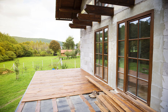 Unfinished wooden flooring in patio