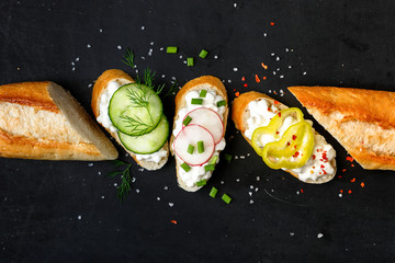 Canapes with cottage cheese  on a black background - obrazy, fototapety, plakaty
