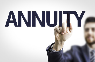 Business man pointing to transparent board with text: Annuity