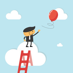 Businessman reach out for balloon