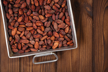 roasted cocoa chocolate beans in Vintage heavy cast aluminum roa