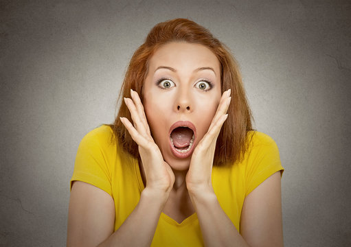 headshot shocked woman with stunned face expression 