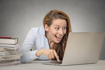 Funny female working on computer ready to press enter button