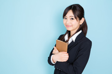 asian businesswoman on blue background