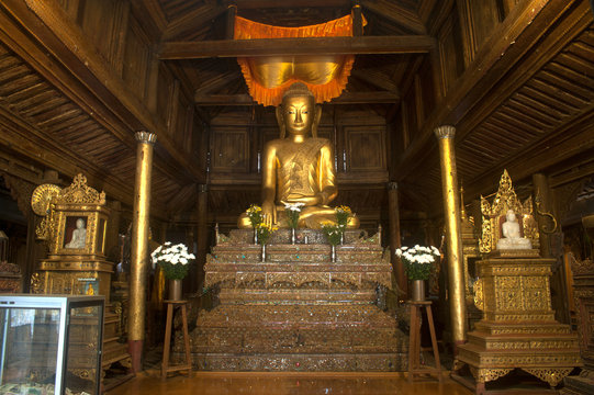 Golden Buddha inside at wood Church of Nyan Shwe Kgua temple.