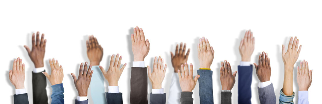 Diverse Business People's Hands Raised
