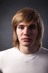 Healthy muscular young man on grey background