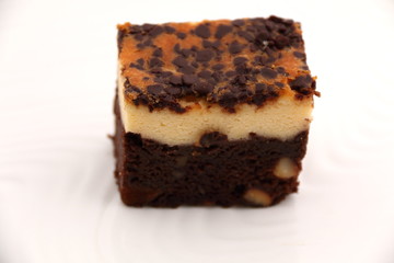 brownie Cheese cake on a white plate.