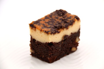 brownie Cheese cake on a white plate.