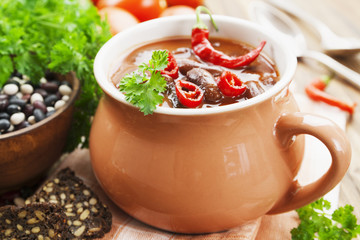 Chili soup with red beans and greens