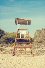 Fototapeta premium Empty lifeguard tower on the beach.