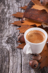 Wooden background with coffee from acorns