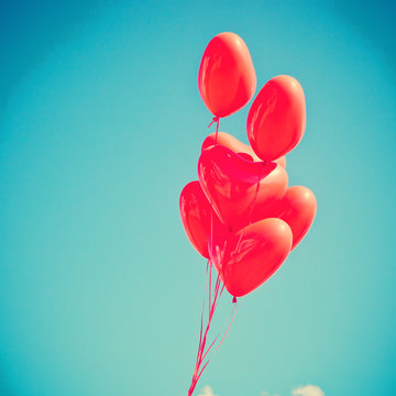 Bunch of red heart-shaped balloons