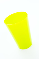 Colorful plastic glass isolated on white background