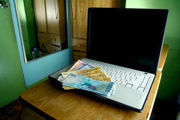 Money on a Computer laptop