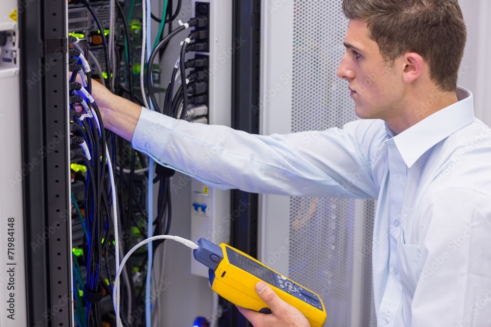 Aufkleber serious technician using digital cable analyzer on server