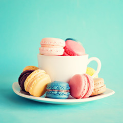 Macaroons in a vintage tea cup