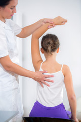 Obraz na płótnie Canvas Chiropractor doing adjustment on female patient