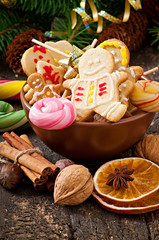 Christmas gingerbread cookies and lollipops in bowl 